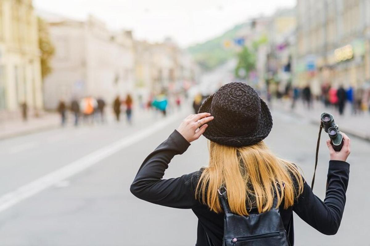 a woman holding a microphone on a city street