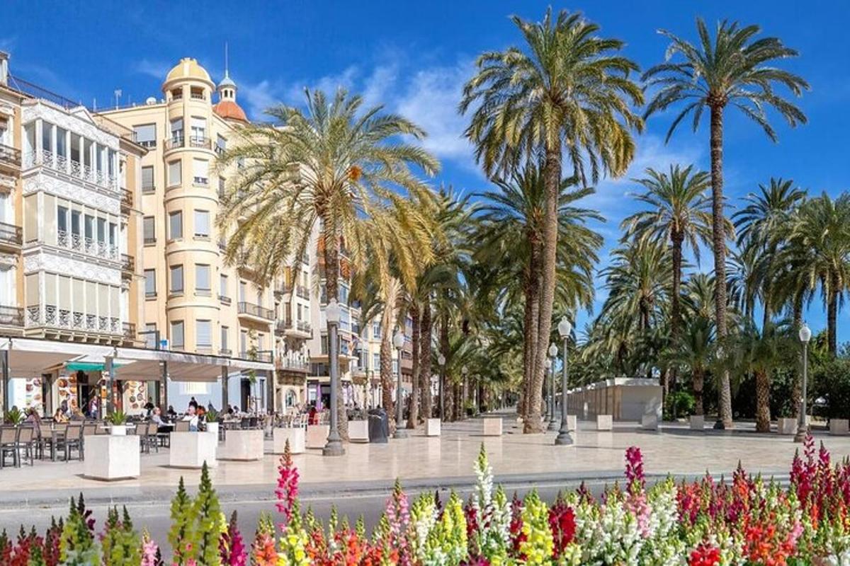 a street with palm trees in front of a building