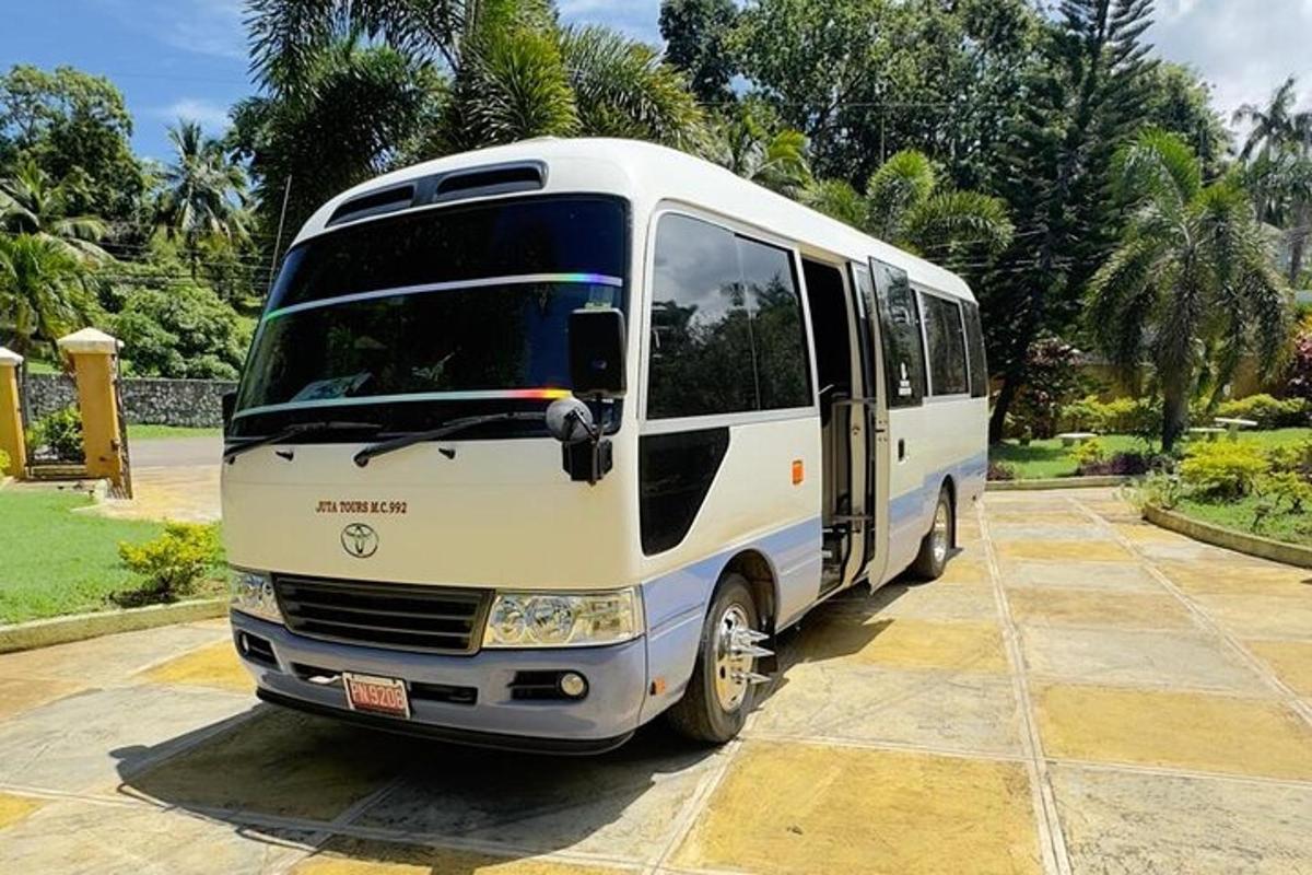 a white bus parked in a parking lot
