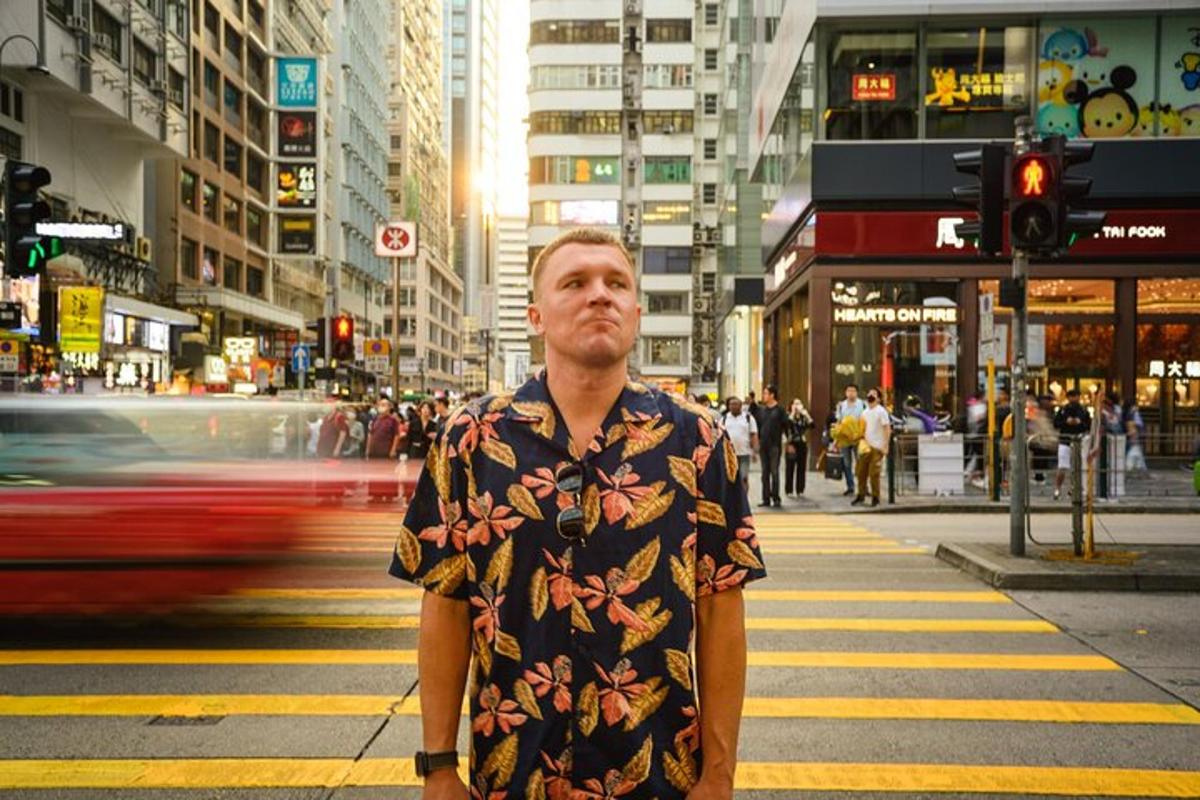 a man is standing on a city street