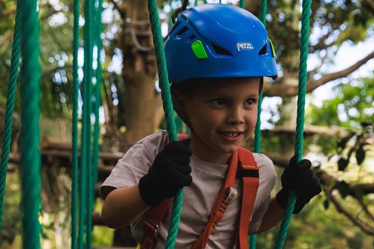 a young boy wearing a hard hat on a playground