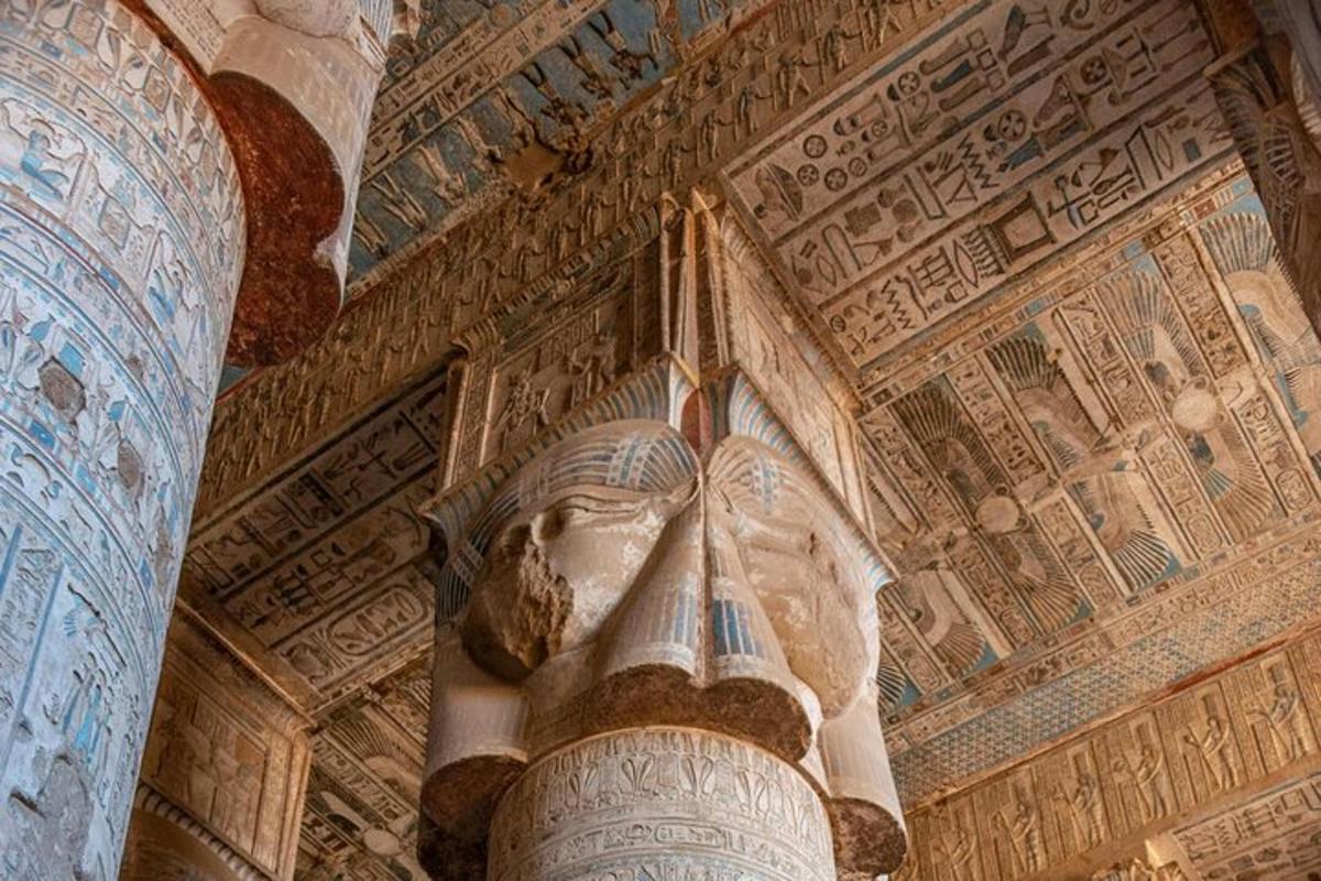 a statue of a head in a building with a ceiling