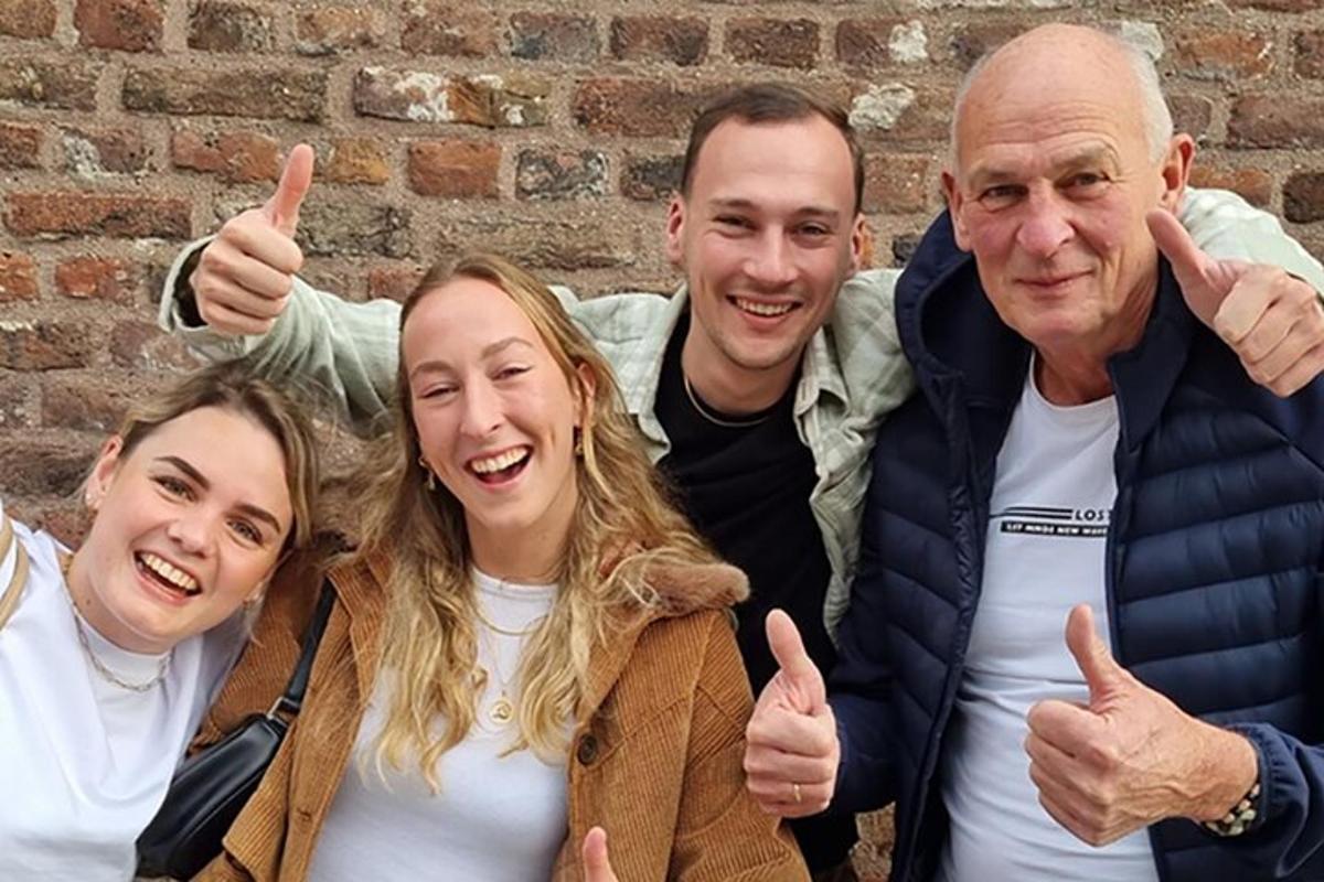 a group of three people giving thumbs up