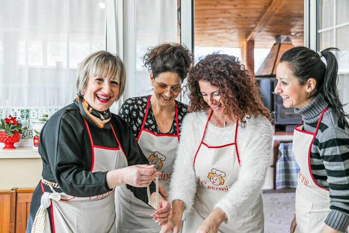 a group of women standing in a kitchen together