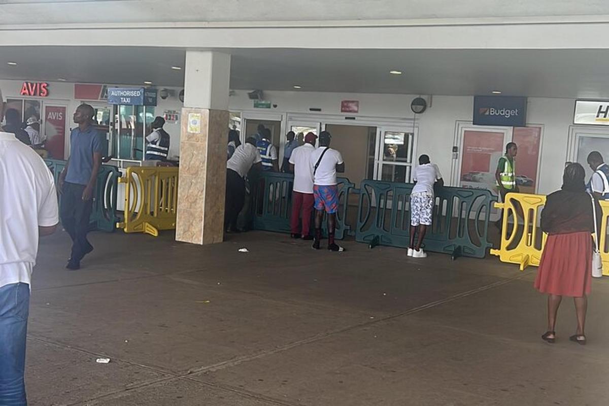 a group of people waiting in line at a store