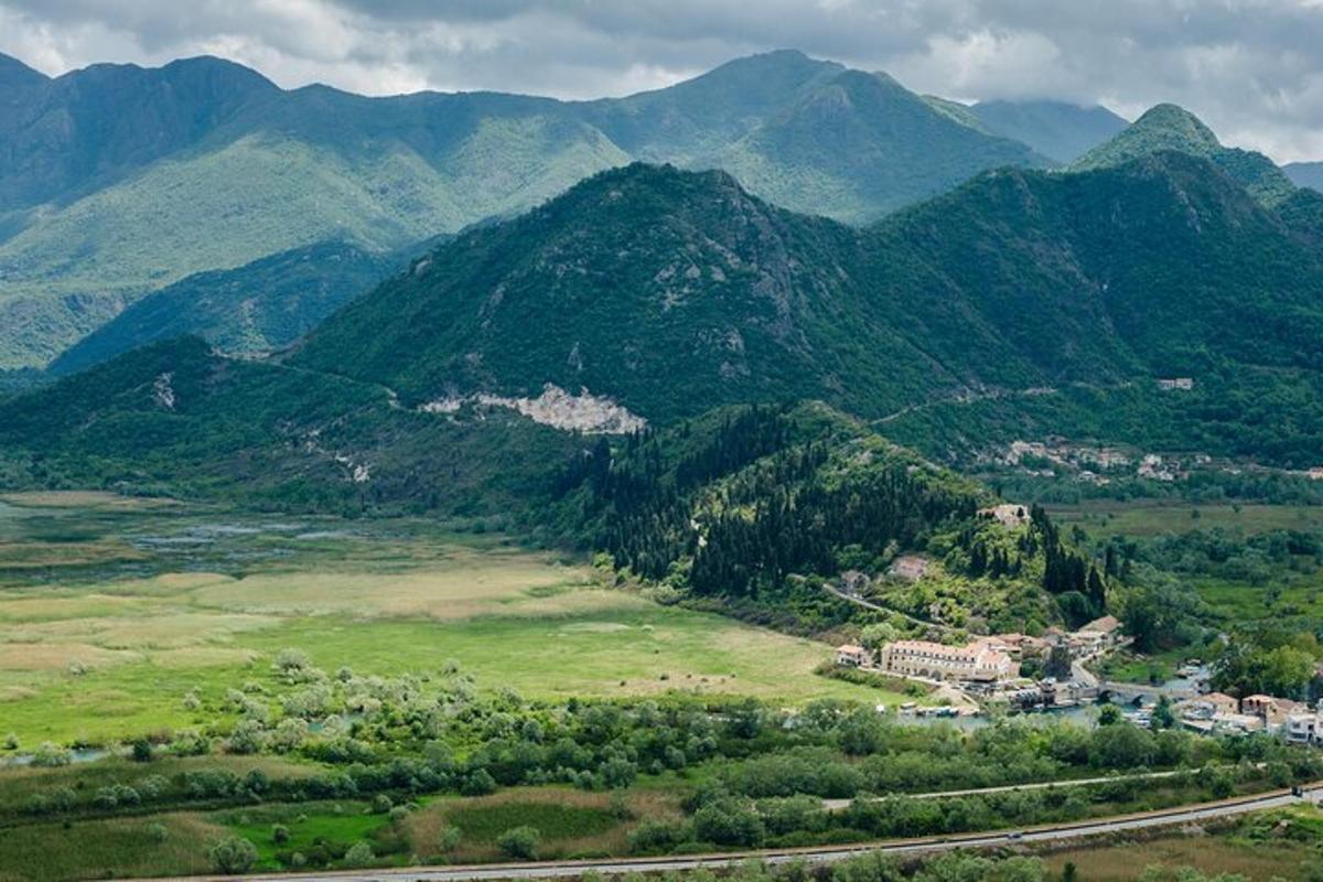 a view of a mountain range with a town in the foreground