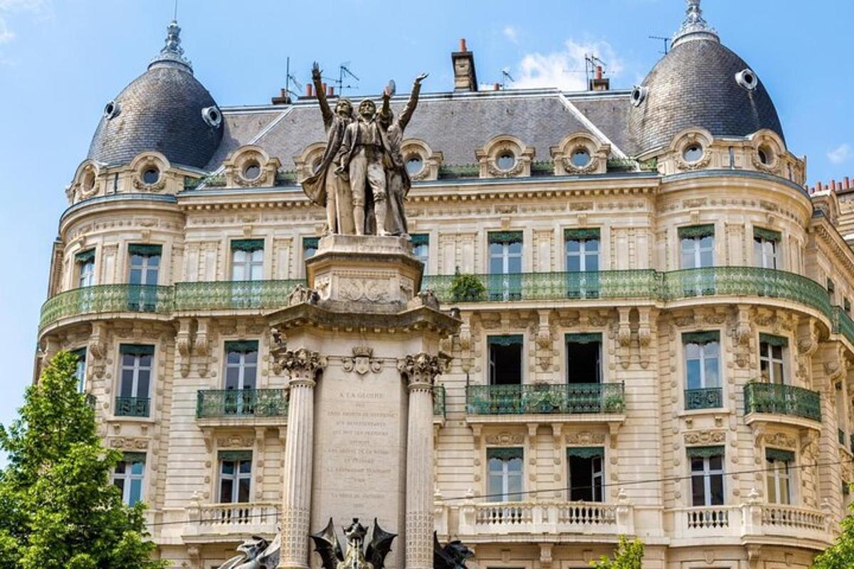 a statue in front of a large building