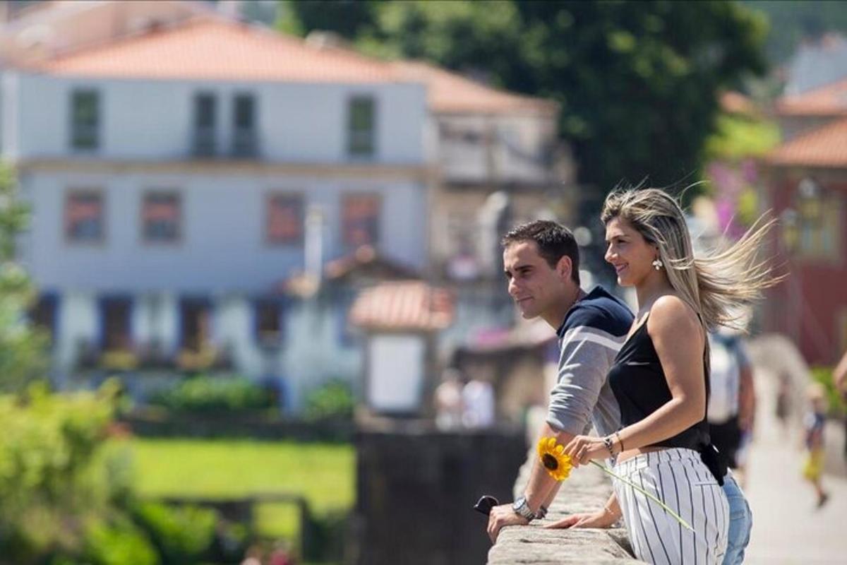 a man and a woman standing on a wall