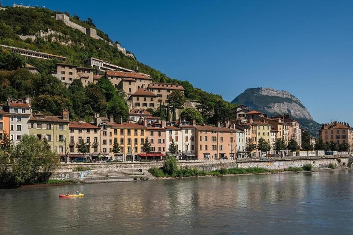 a group of buildings on the side of a river