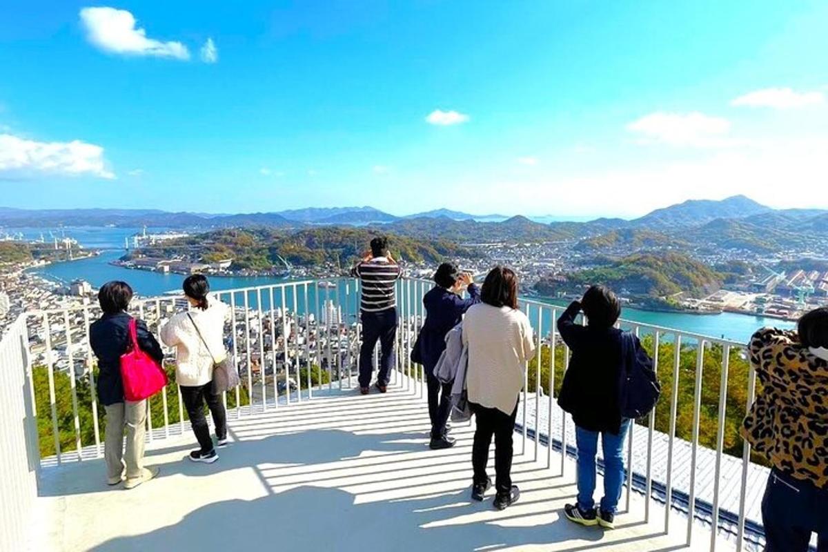 a group of people standing on top of a viewing deck