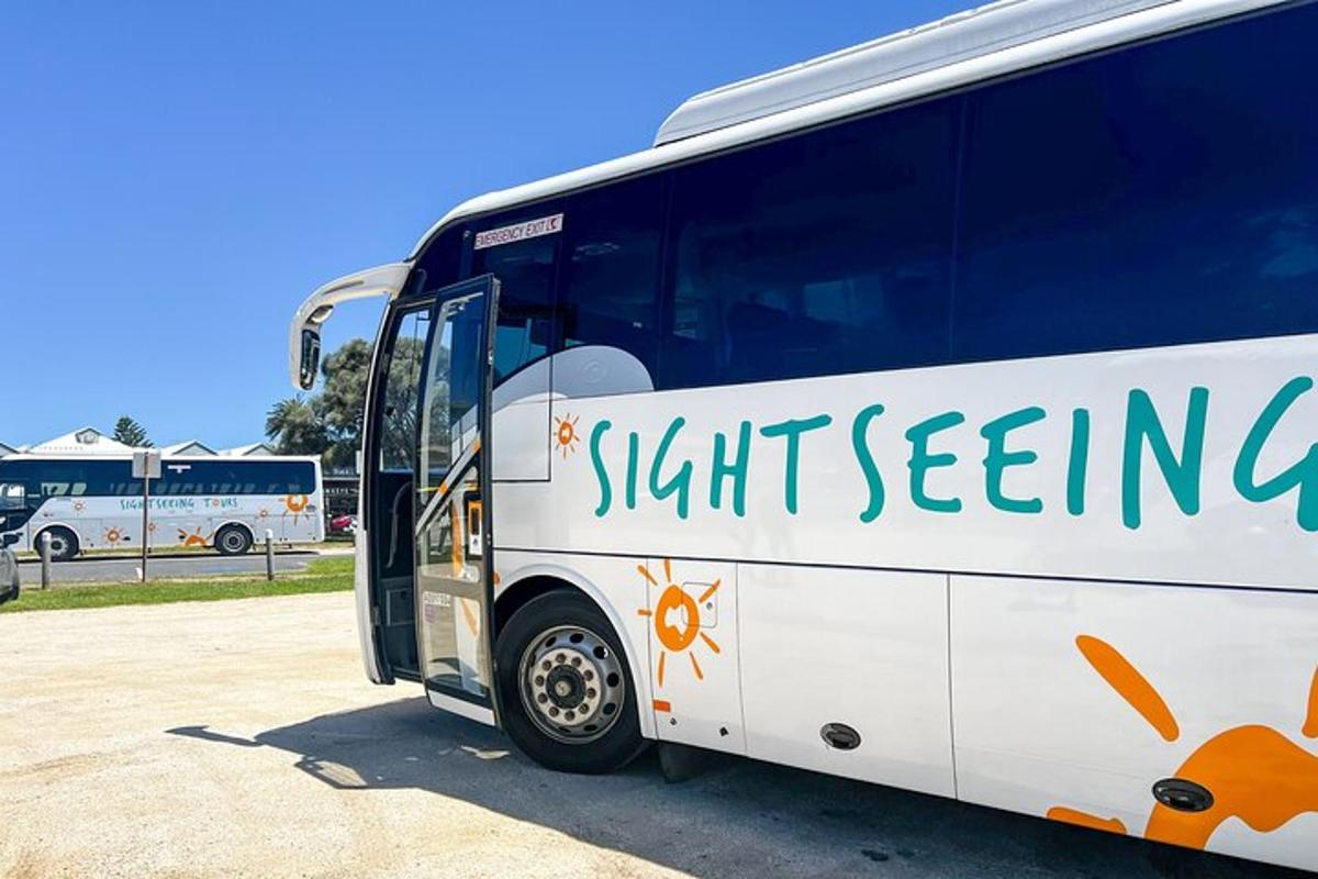 a bus parked in a parking lot with its door open