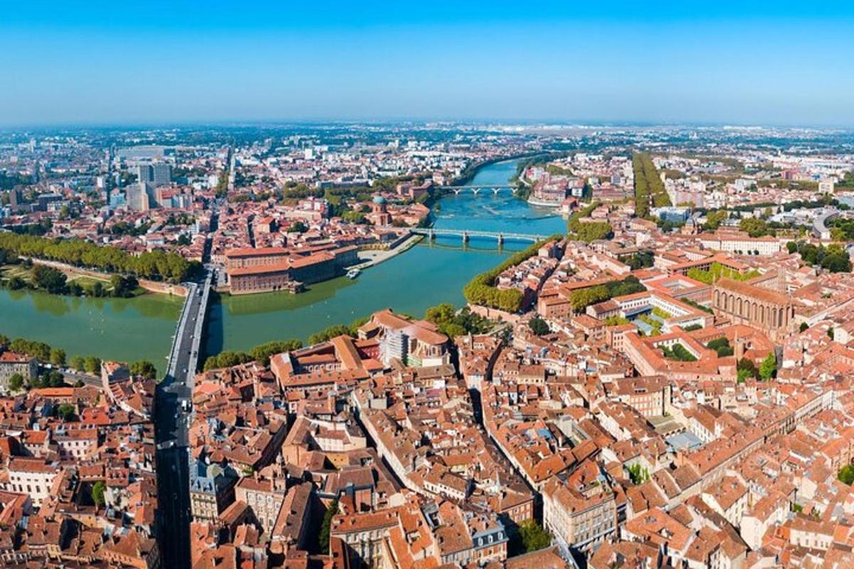 an aerial view of a city with a river