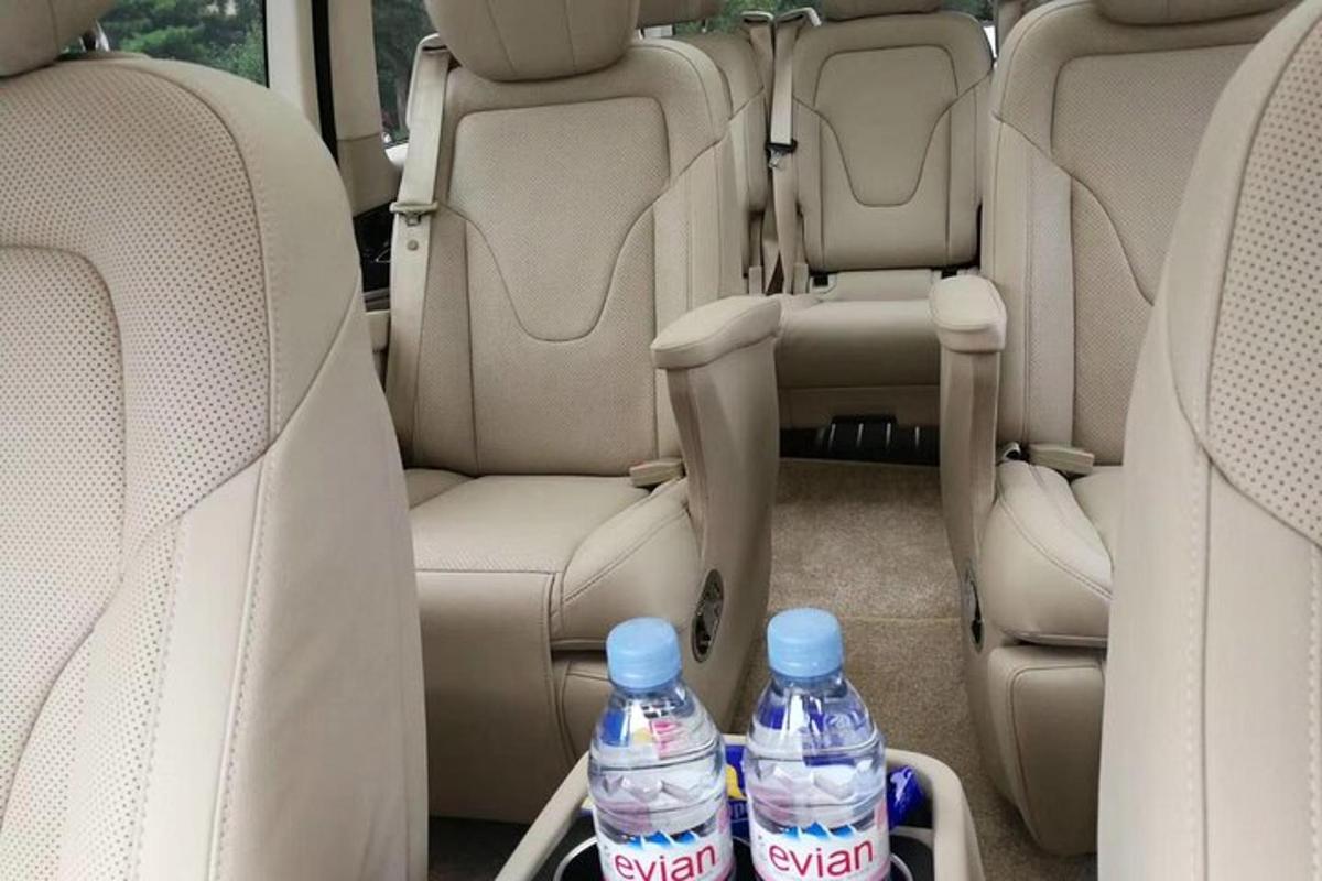 two bottles of water sitting in the back seats of a car