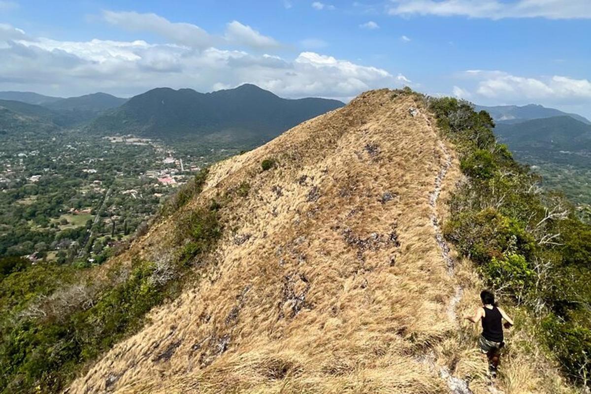 a man standing on the top of a mountain