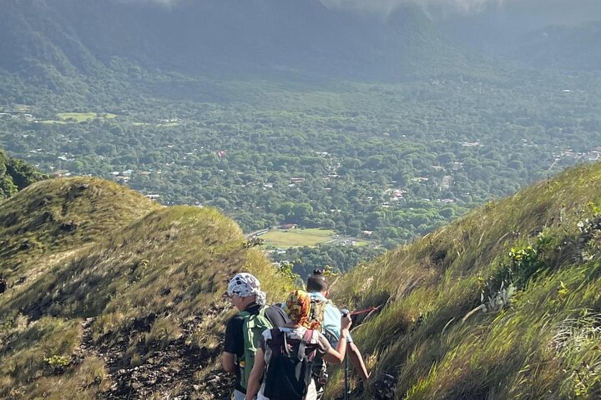 two people standing on top of a mountain