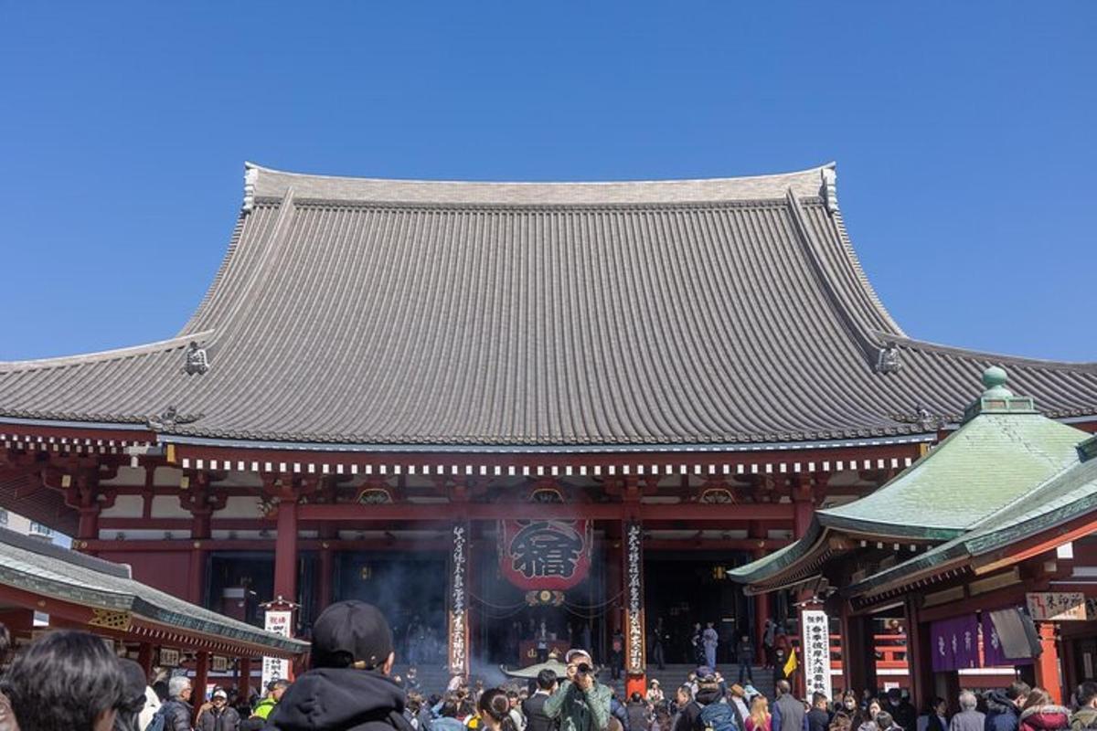 a crowd of people standing in front of a temple