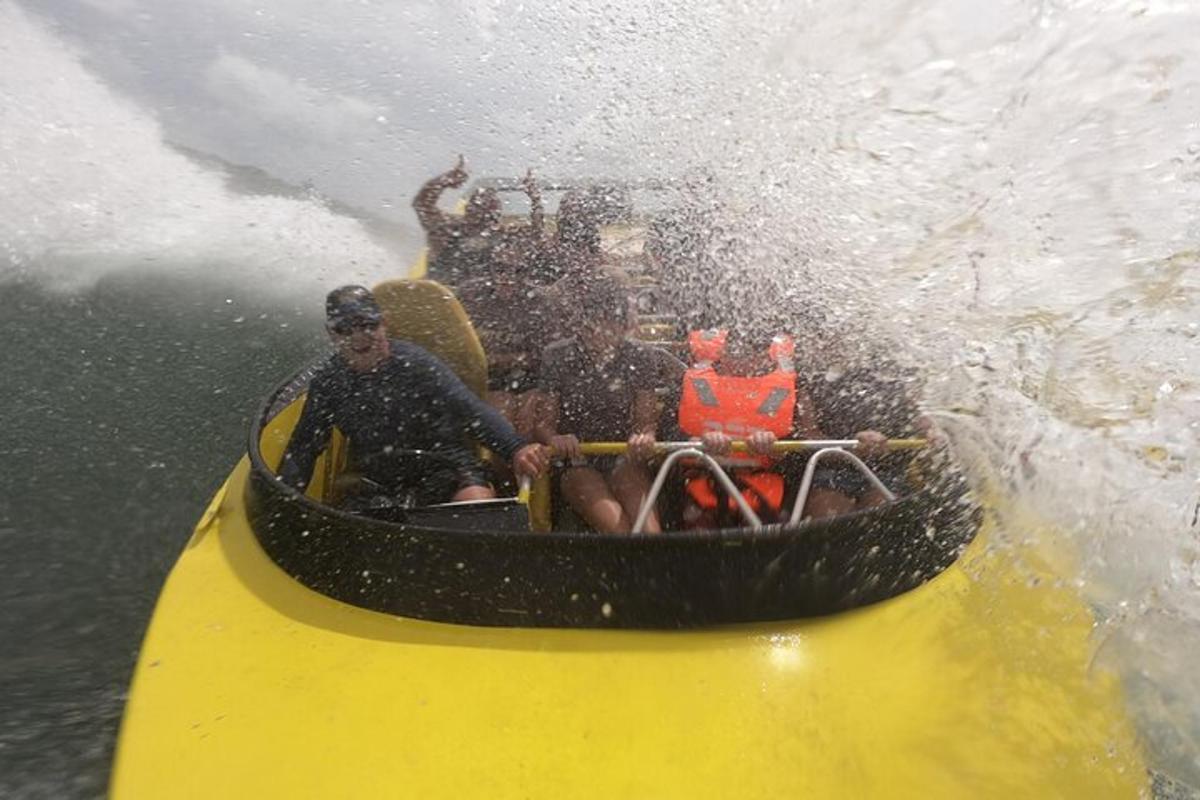 a group of people in a raft in the water