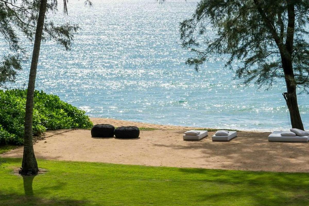 a group of objects sitting on the sand near the water