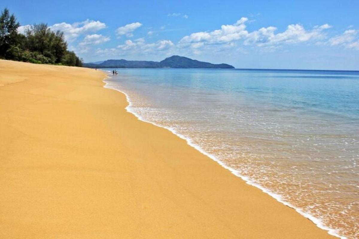 a beach with the ocean and the shoreline