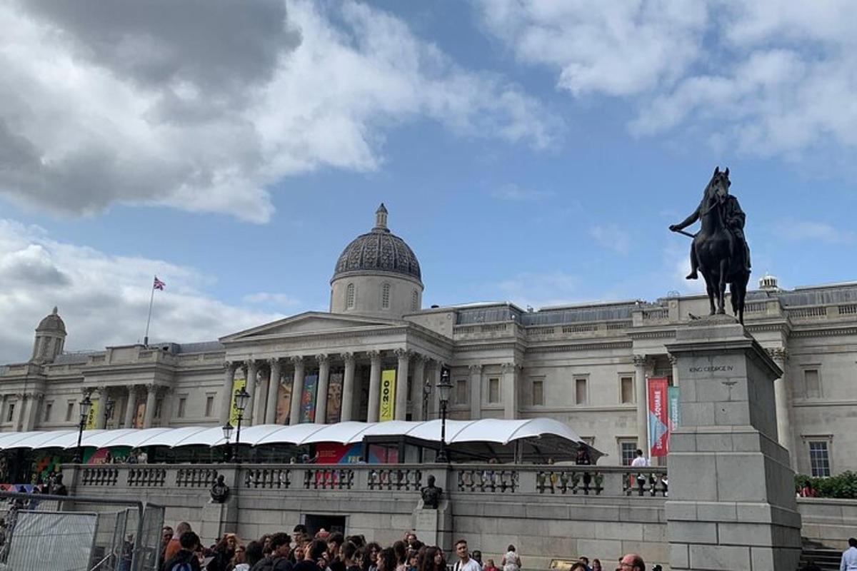 a large building with a statue of a man on a horse