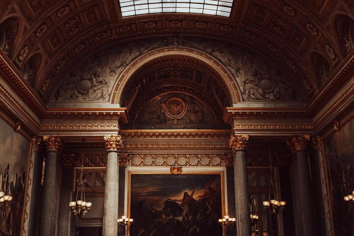 a room with a painting of horses on the wall