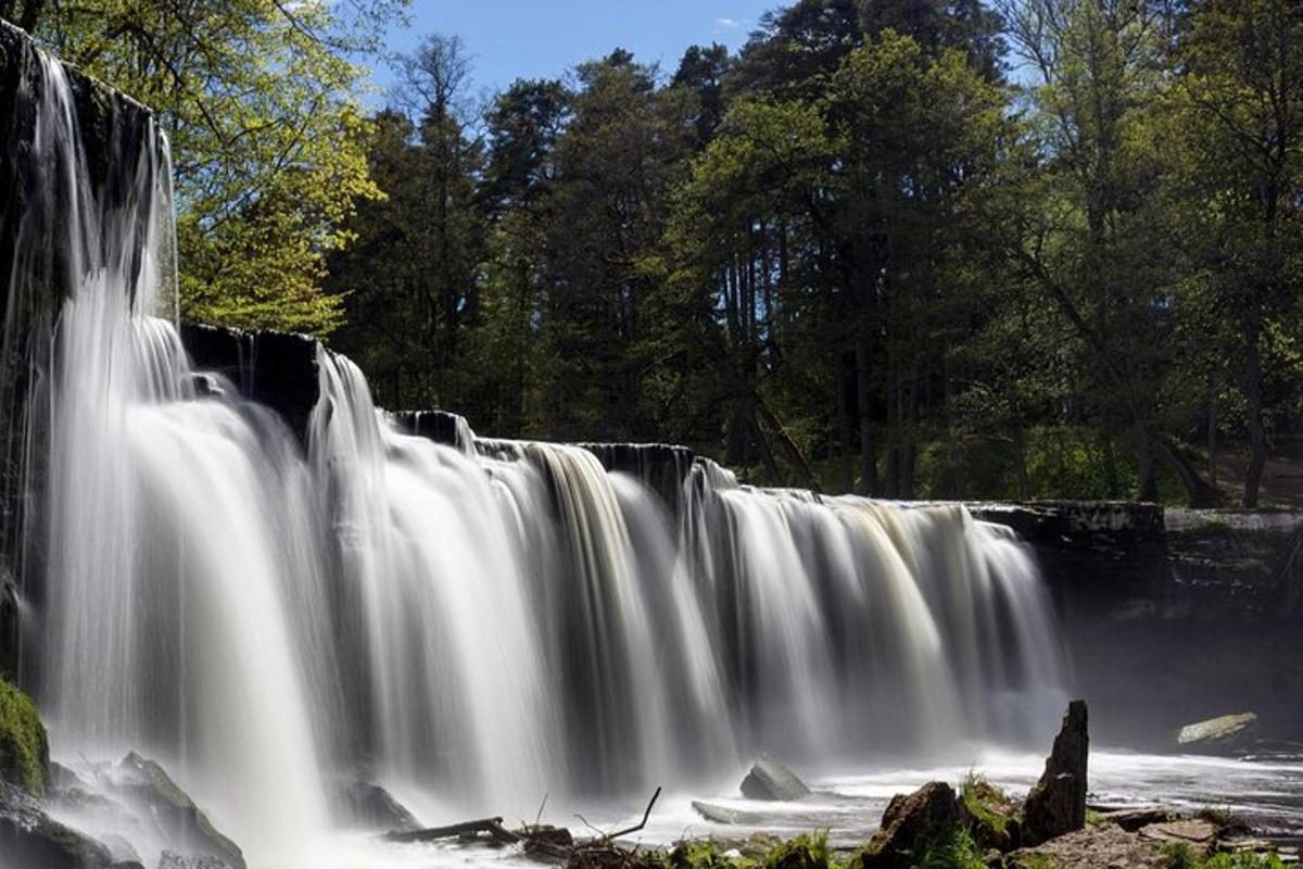 a waterfall in the middle of a river