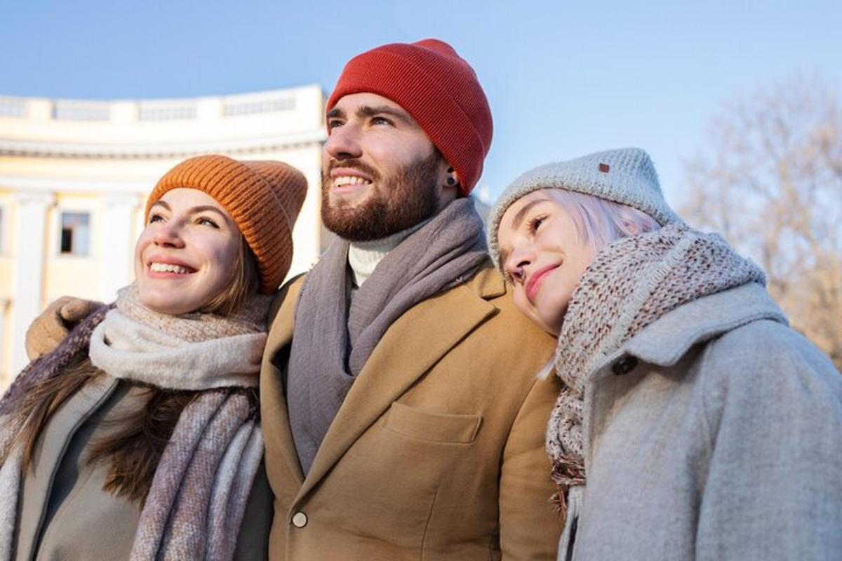 a group of three people standing next to each other