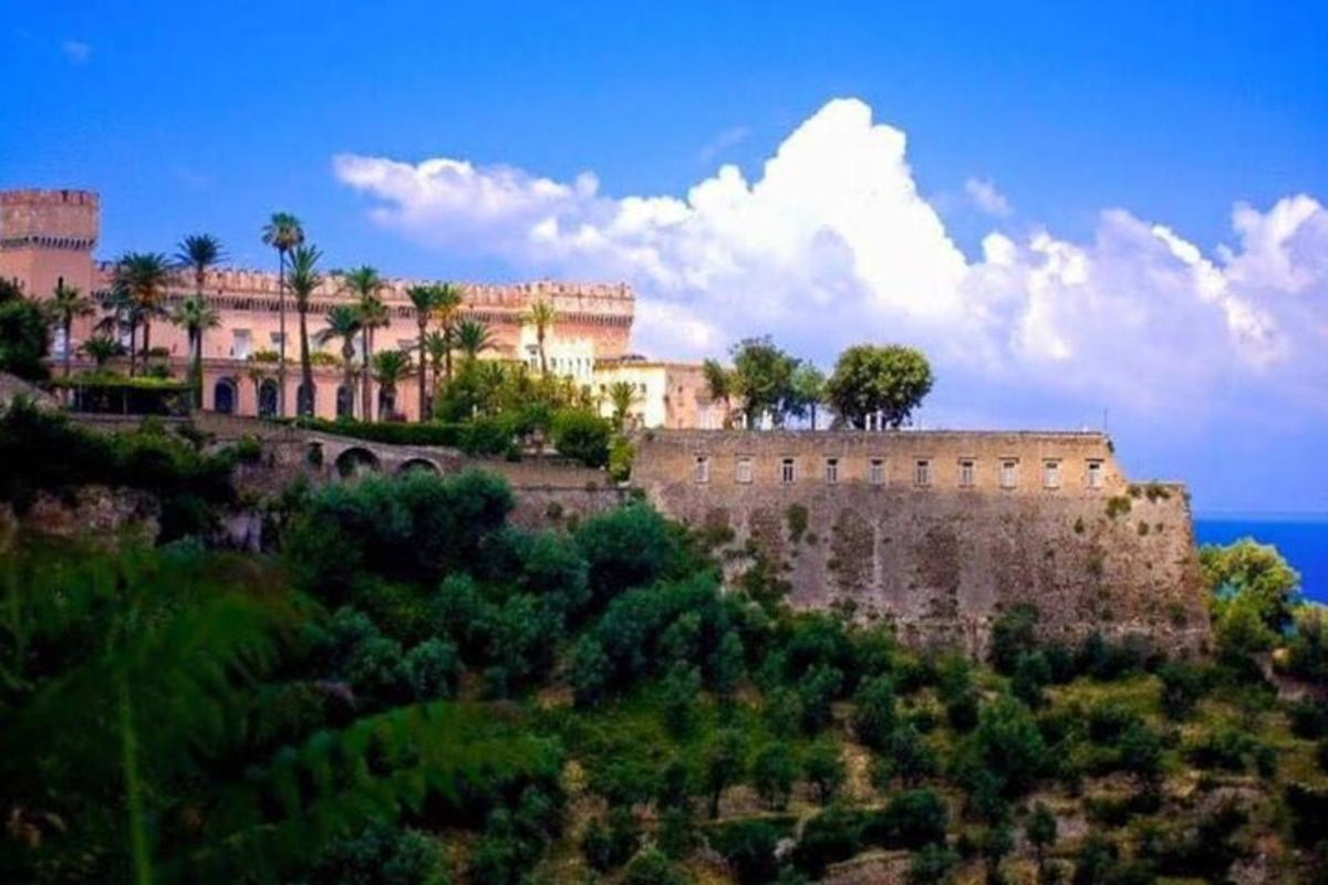 a building on top of a hill with trees