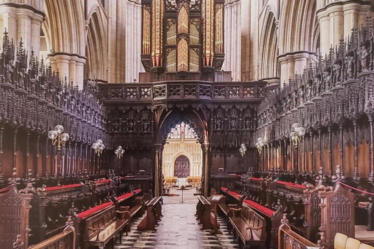 a large cathedral with rows of benches in it