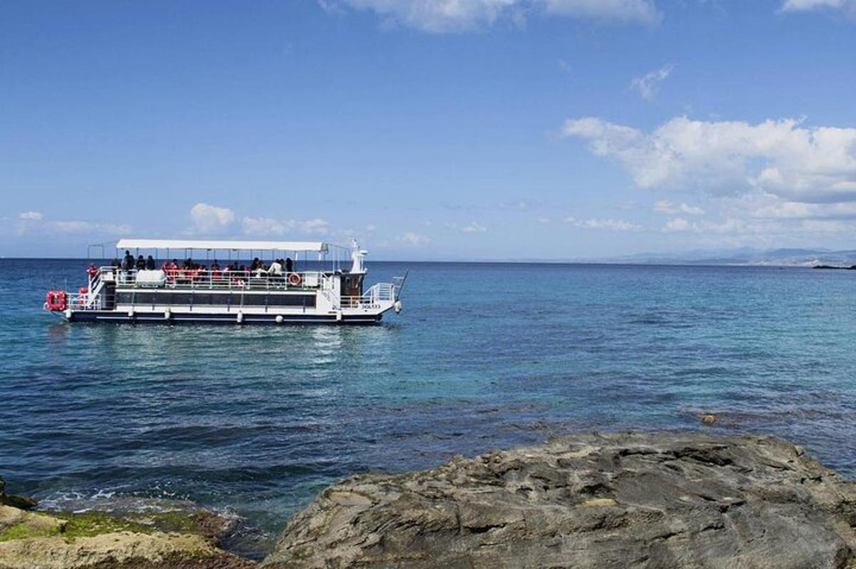 a boat with people on it in the water