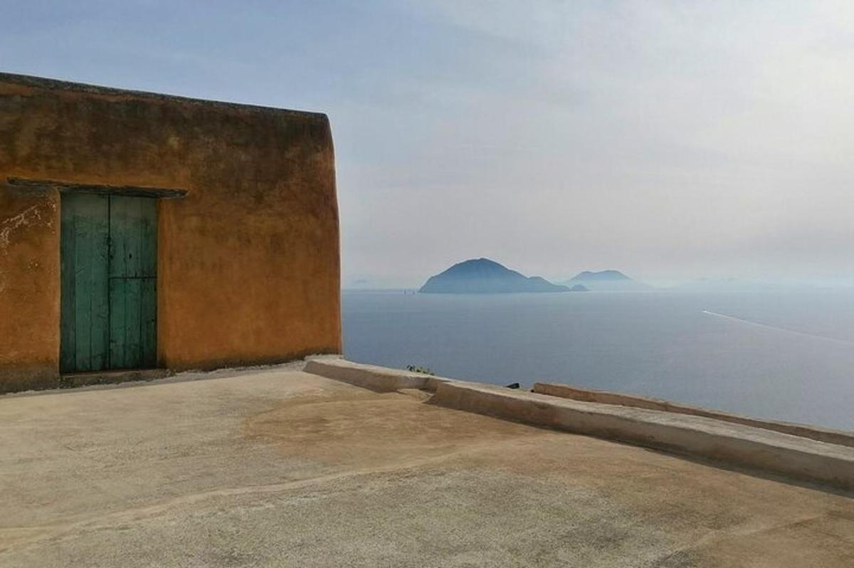 a building with a door next to the water