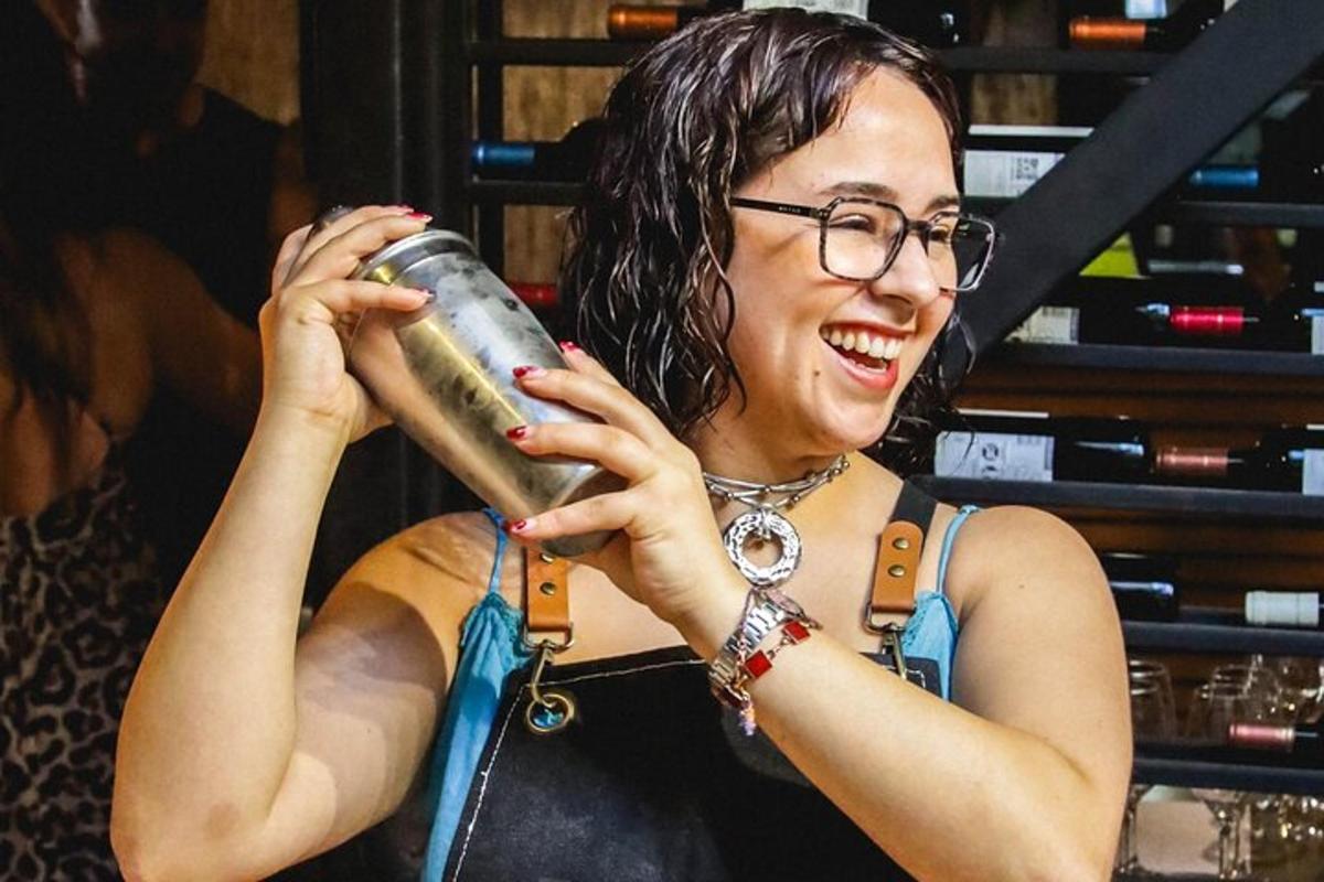 a woman with glasses is holding a cup
