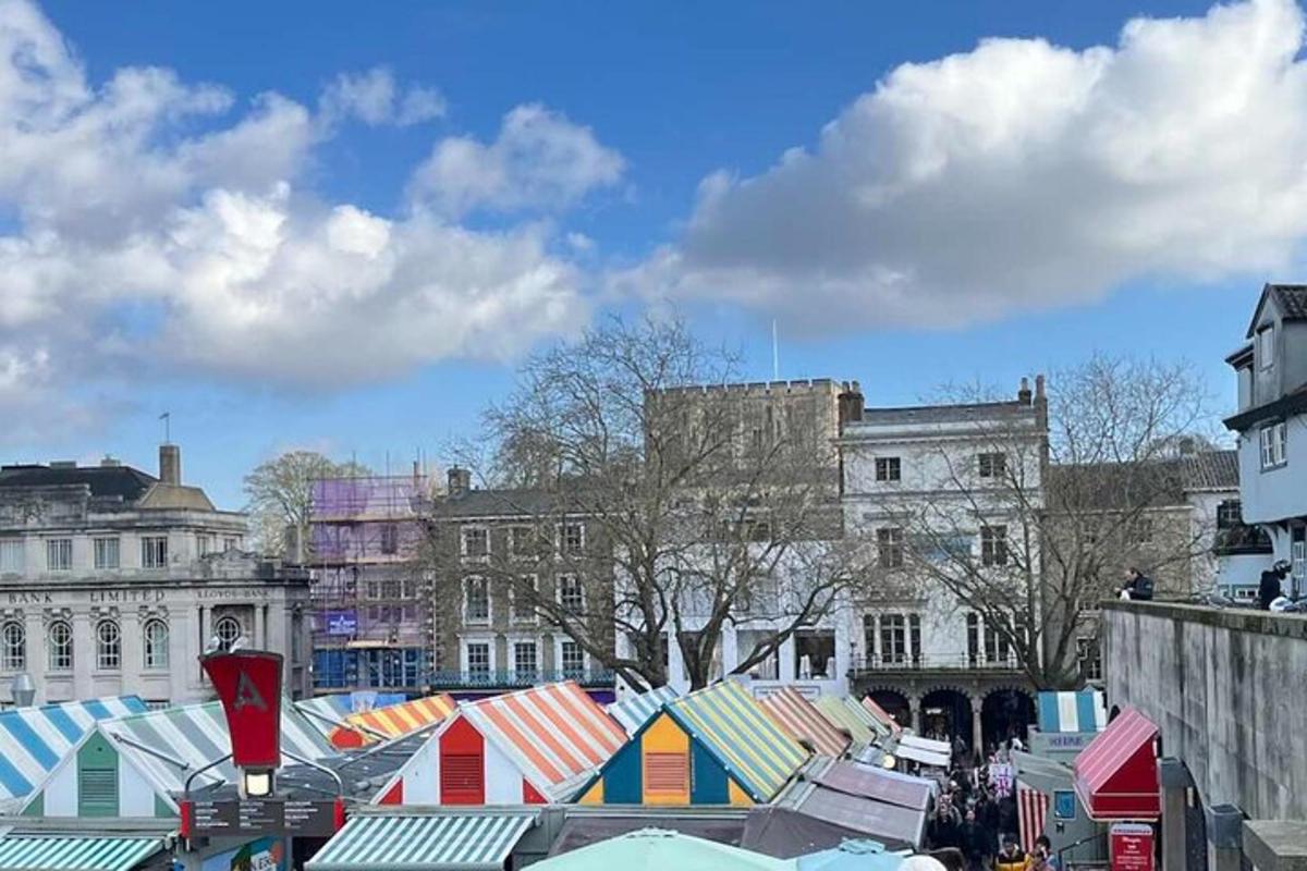 a market with colorful stalls in a city