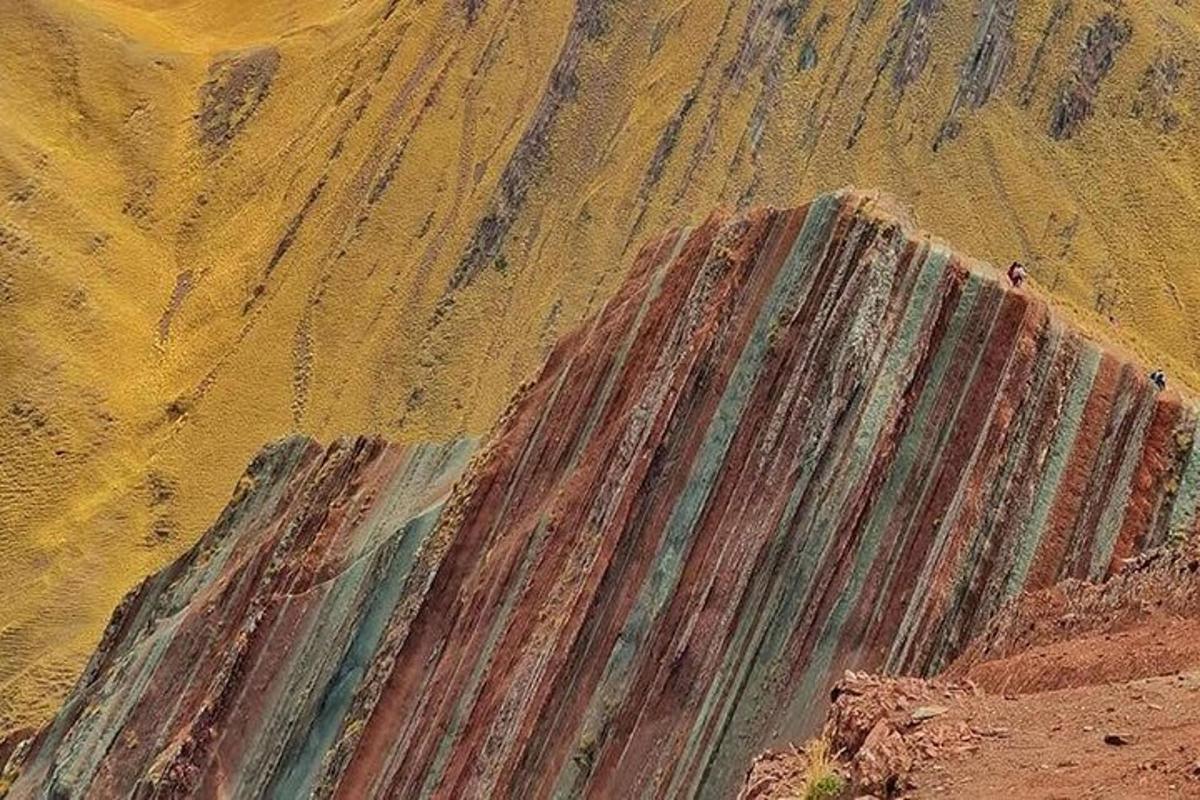 a painting of a mountain with people on it