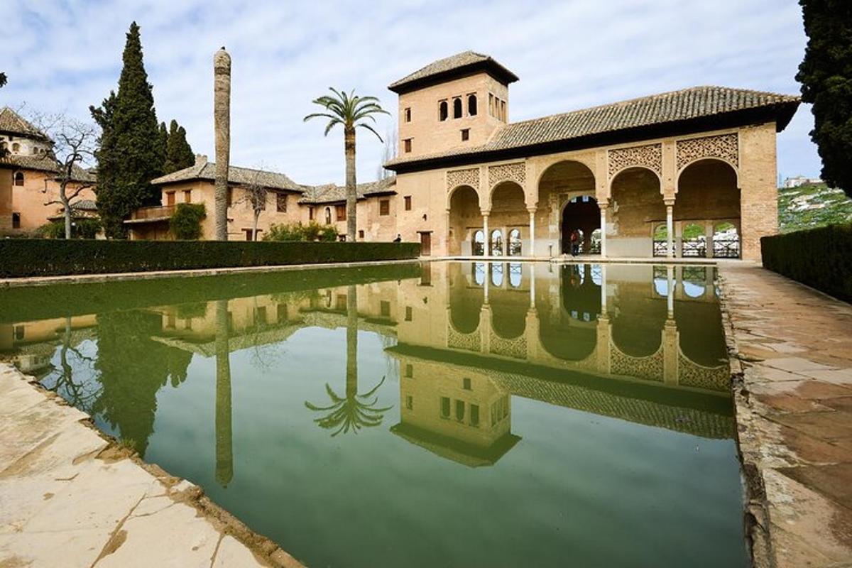 a building with a reflection in a pool of water