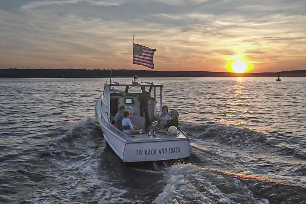 a group of people on a boat in the water