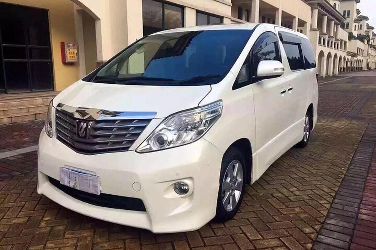 a white van parked on a brick street