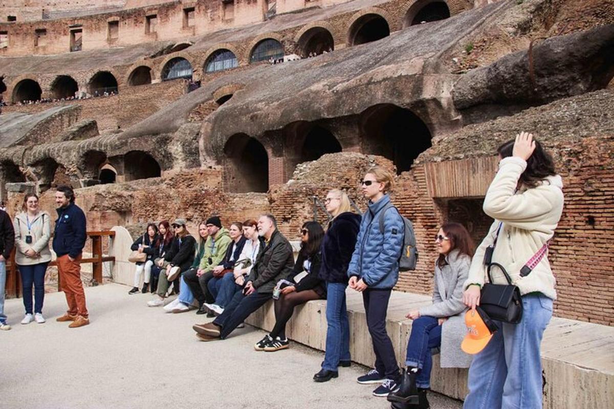a group of people standing in front of an amphitheater