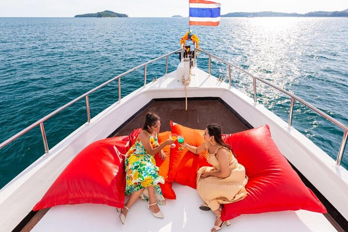two women sitting on the front of a boat