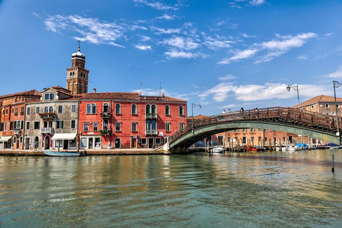 a bridge over a river in a city with buildings
