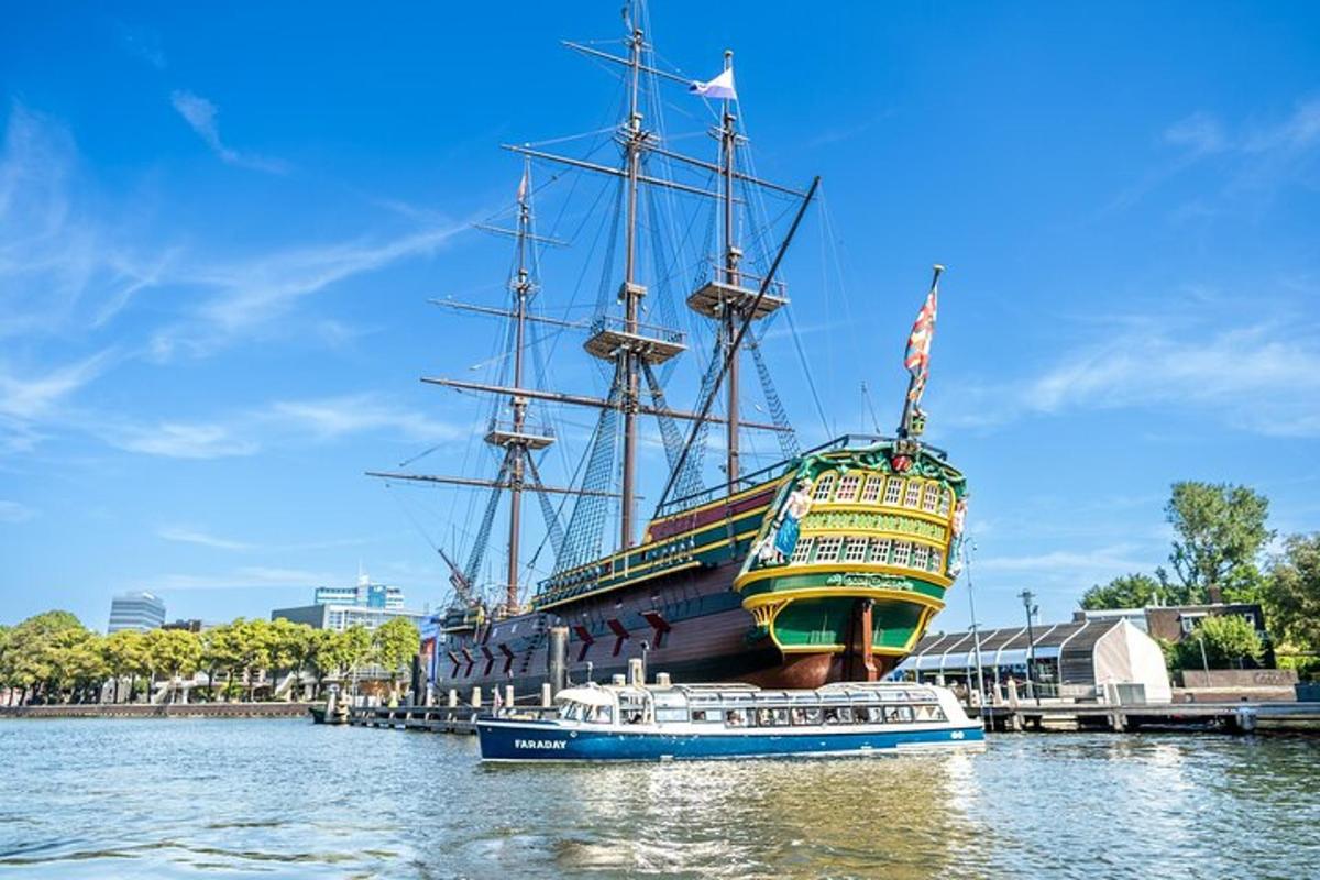 a large ship is docked next to a boat