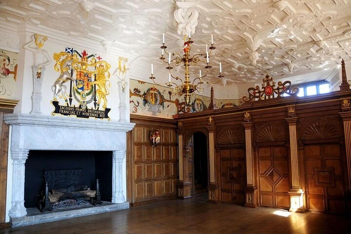 a living room with a fireplace and a chandelier