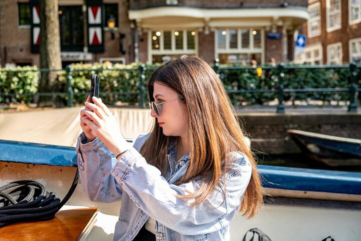 a young woman taking a picture with her cell phone