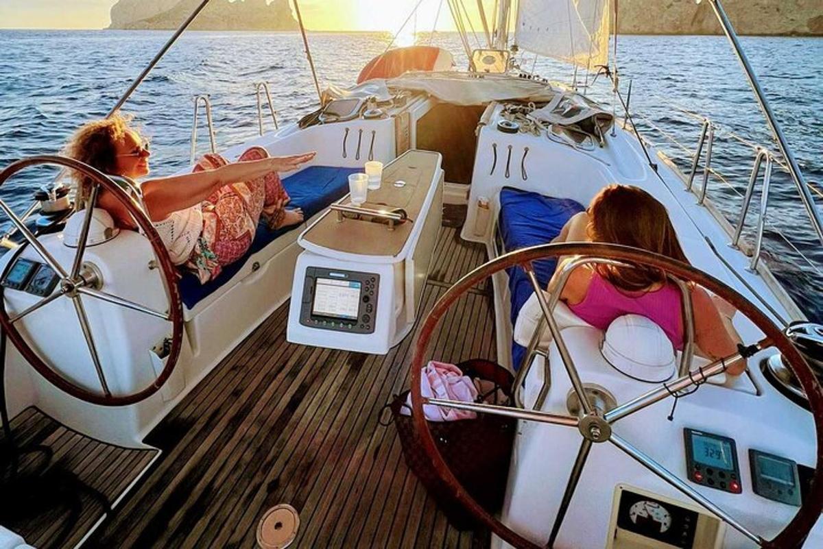 two women sitting on a boat in the water