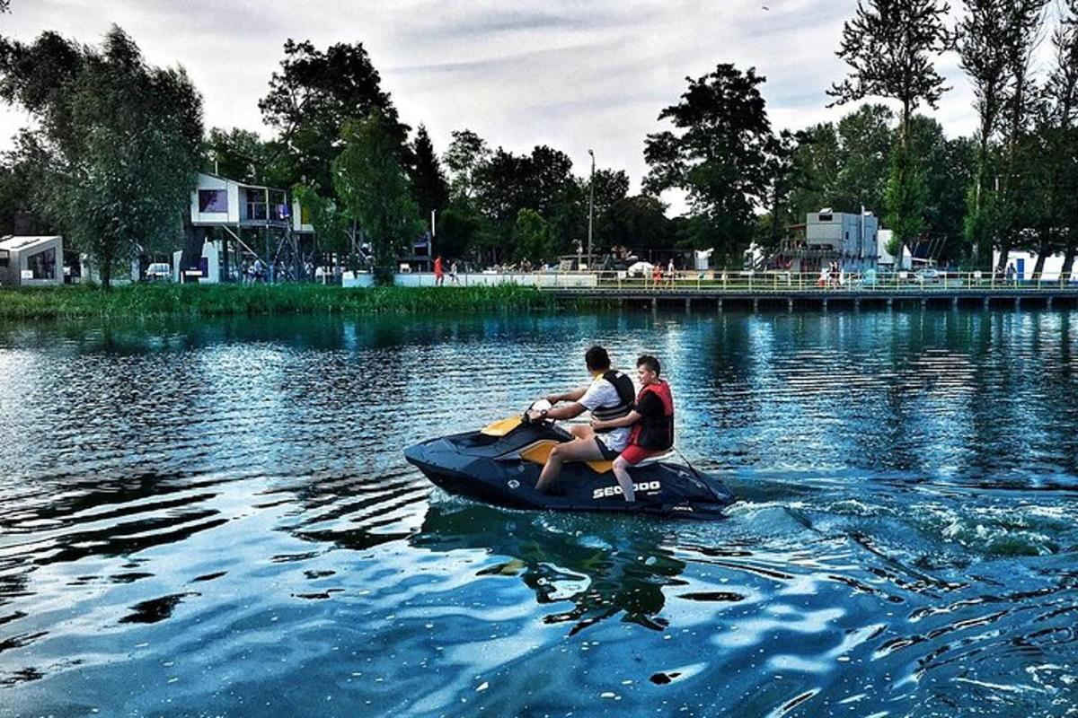 two people on a paddle boat in the water