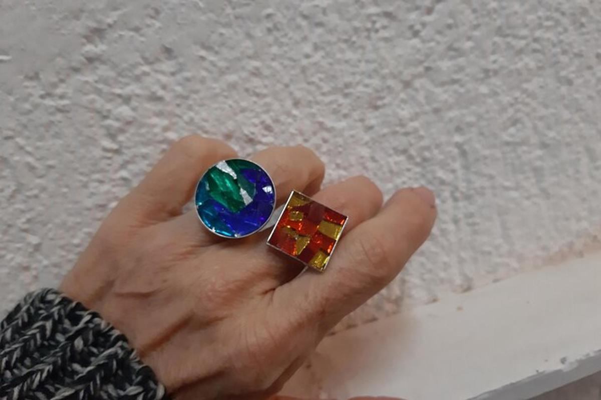 a person holding a gem in their hand