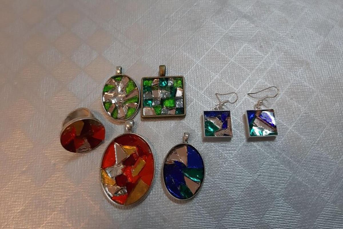 a group of glasses with different colored stones and photos