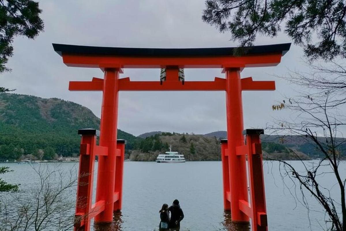 a torii gate in the middle of a body of water