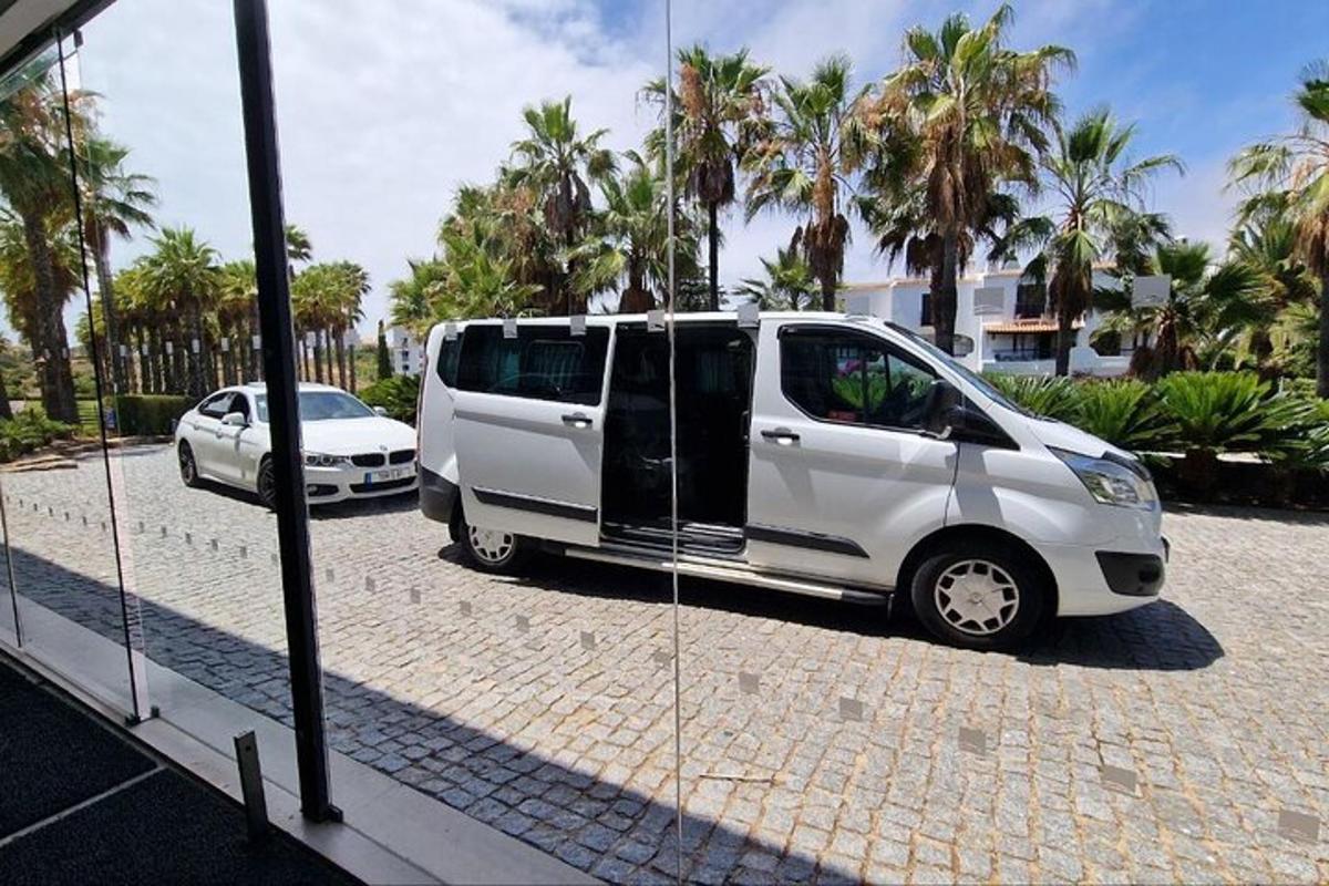 a white van is parked in a parking lot