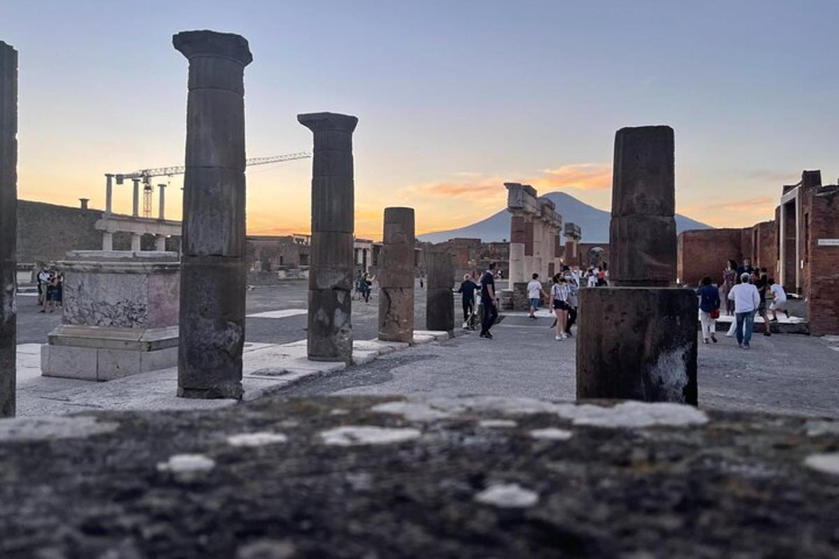 a group of people walking around an ancient ruins